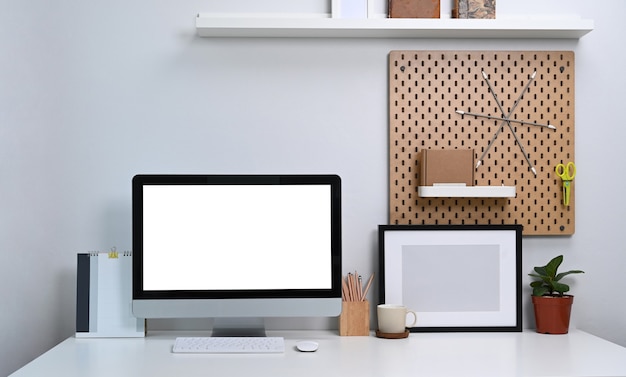 Premium Photo | Workspace with laptop, photo frame, coffee, plant ...