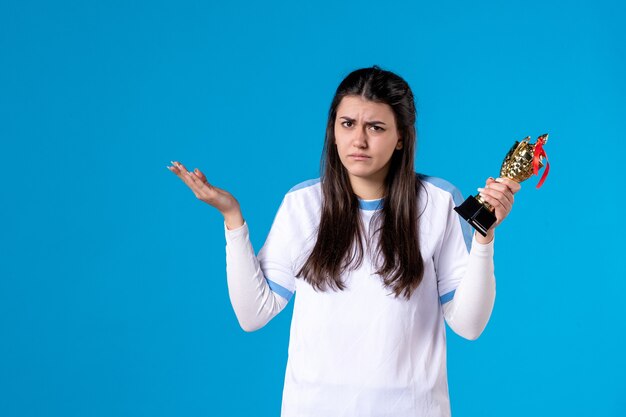 Front view confused female player with cup