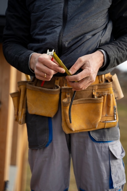 Front view construction worker wearing belt
