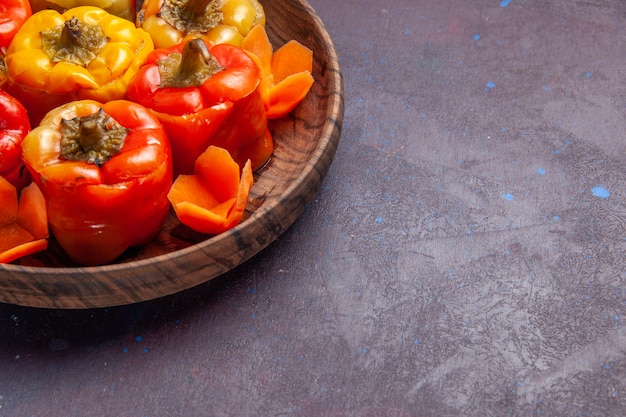 Front view cooked bell-peppers with ground meat inside on grey surface meal food meat vegetable cooking