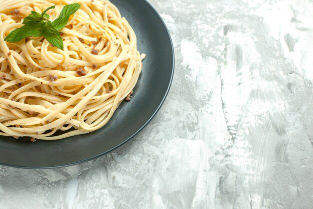 Front view cooked italian pasta inside plate on white background