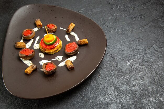 Front view cooked squashes designed meal inside plate on dark grey space