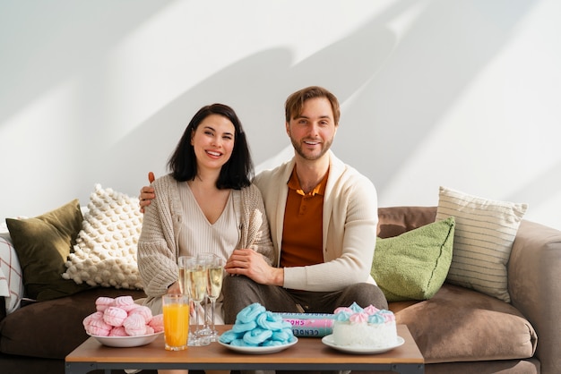 Free photo front view couple at gender reveal party