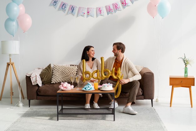 front view couple at gender reveal party
