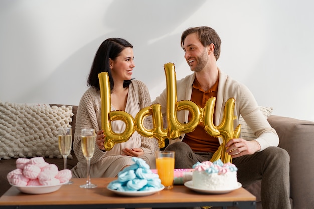 front view couple at gender reveal party