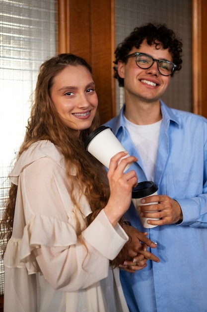 Free photo front view couple having a bookstore date