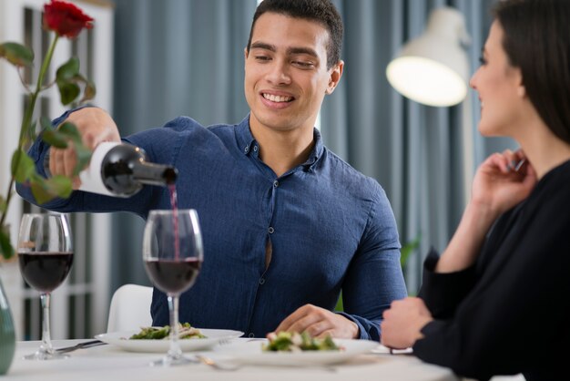 Front view couple having a romantic dinner together