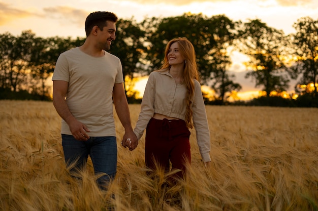 Front view couple holding hands