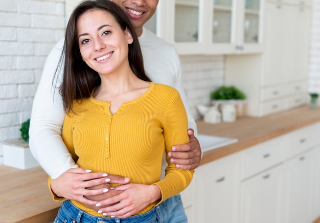 Free photo front view of couple hugging