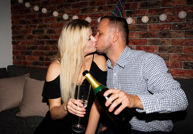 Front view of couple kissing on new year eve