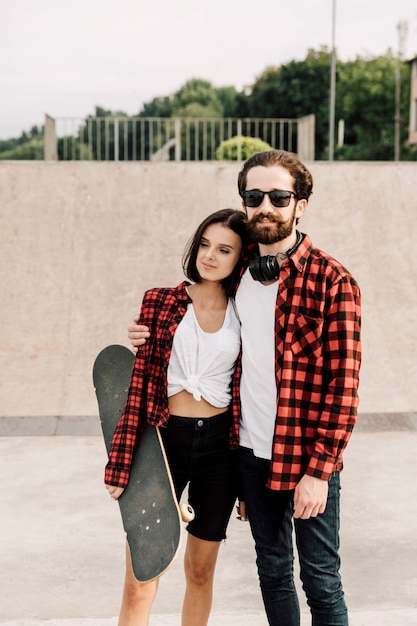 Free photo front view of couple in matching outfits