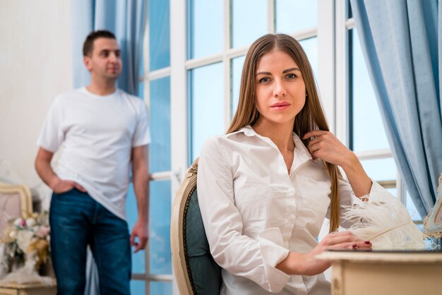 Front view of couple posing with feather