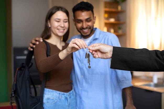 Front view couple receiving keys