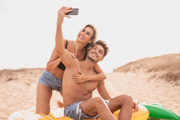 Front view of couple taking photo together