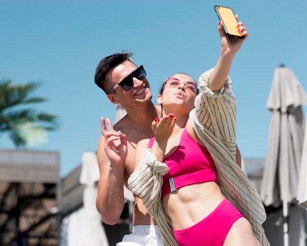 Front view of couple taking a selfie