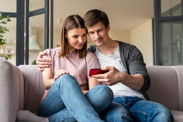 Front view of couple talking on videocall