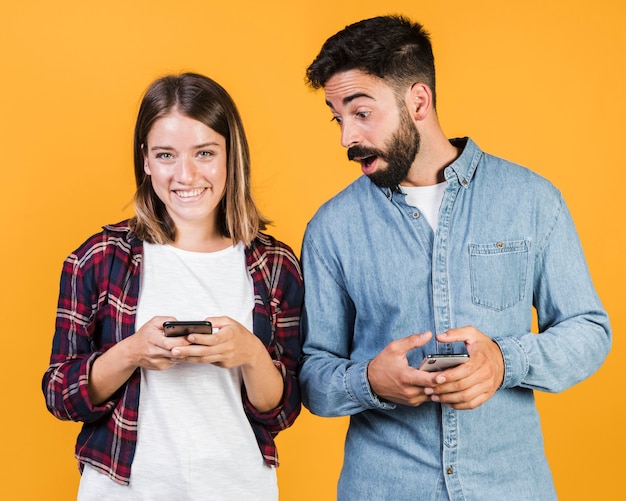 Front view couple with their phones