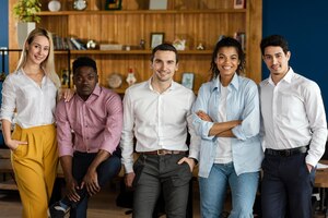 Free photo front view of coworkers posing together at work