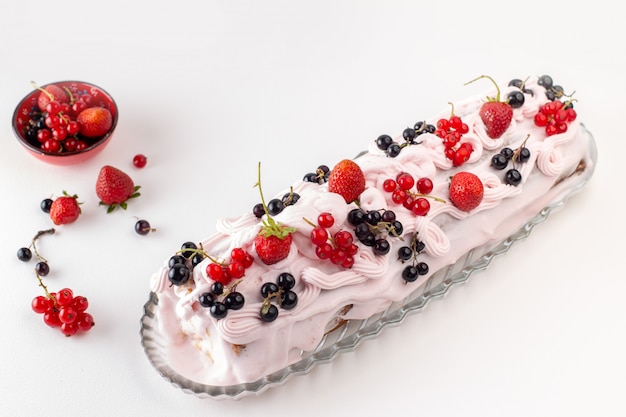 Front view of cream cake with different fruits on top