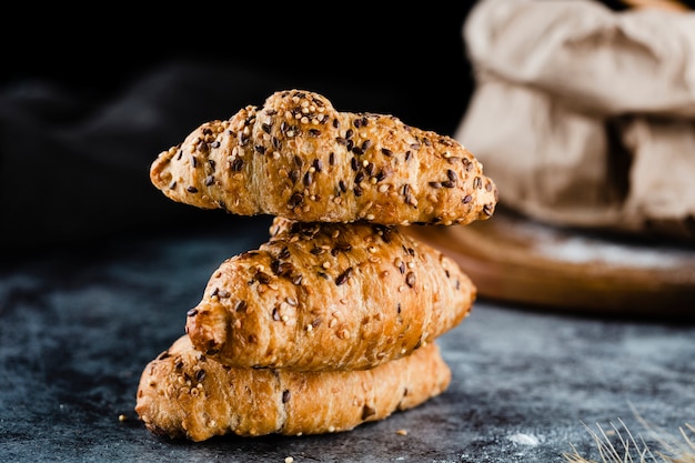 Free photo front view of croissants on black background