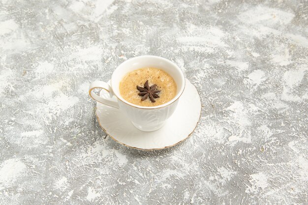 Front view cup of coffee on white surface