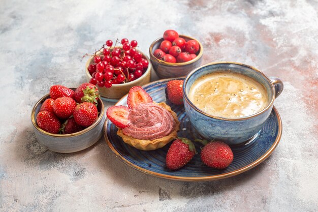 Front view cup of coffee with cake and red fruits on light background