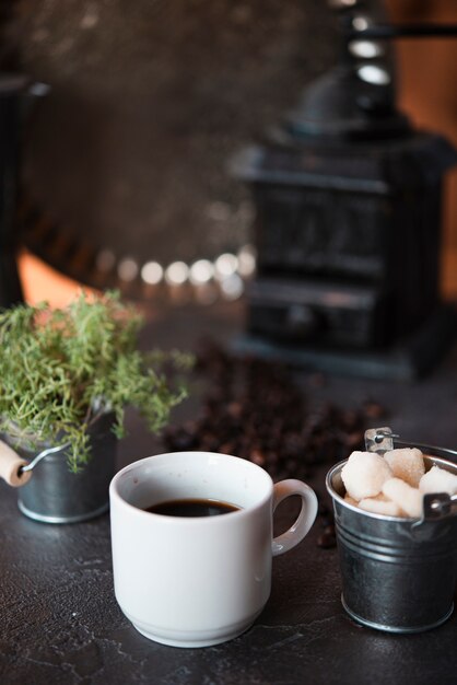 Front view cup of coffee with sugar cubes