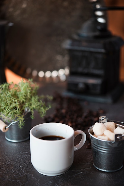 Front view cup of coffee with sugar cubes