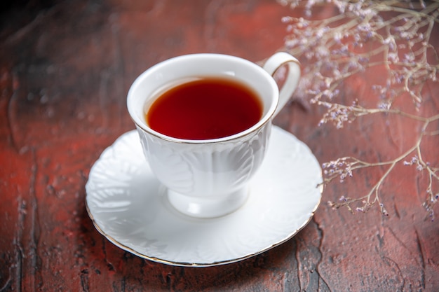 Front view cup of tea on dark background