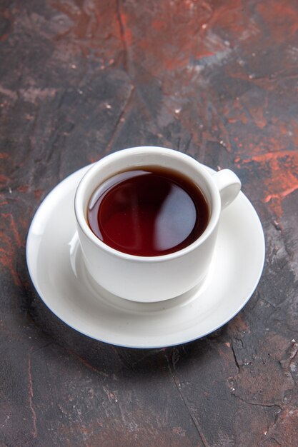 Front view cup of tea on dark table color dark ceremony tea