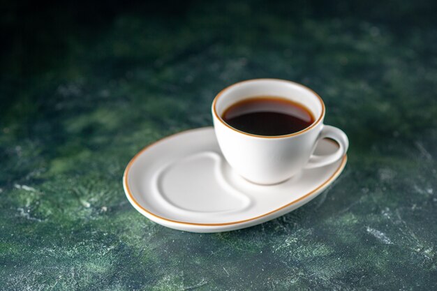 Free photo front view cup of tea in white plate on dark surface color ceremony breakfast morning photo bread glass drink