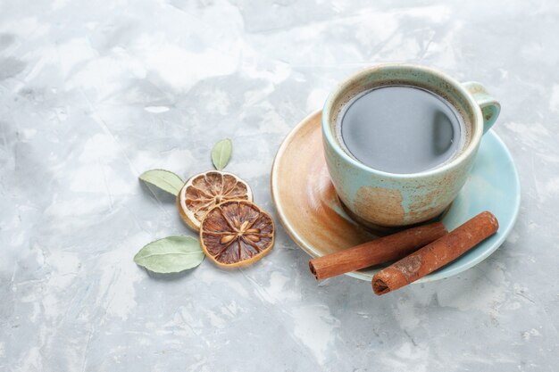 Front view cup of tea with cinnamon on white background drink tea cinnamon lemon color