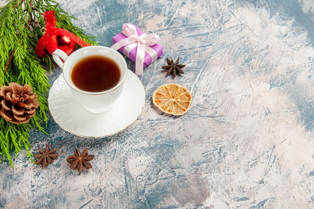 Front view cup of tea with green branch