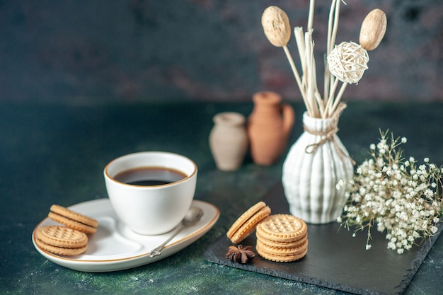 front view cup of tea with sweet biscuits on dark surface bread drink ceremony breakfast morning glass sugar photo color cake sweet