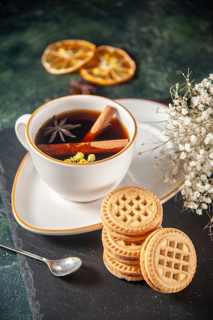 front view cup of tea with sweet biscuits on dark surface bread drink ceremony glass sweet breakfast cake color photo morning