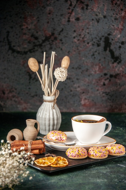 front view cup of tea with sweet biscuits in plate and tray on dark surface ceremony glass sweet breakfast sugar cake dessert