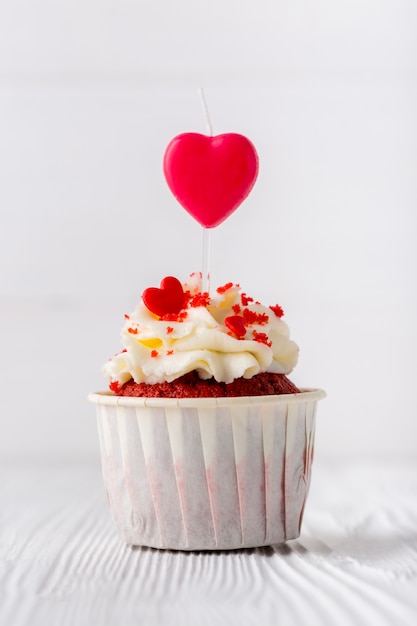 Front view of cupcake with heart-shaped sprinkles