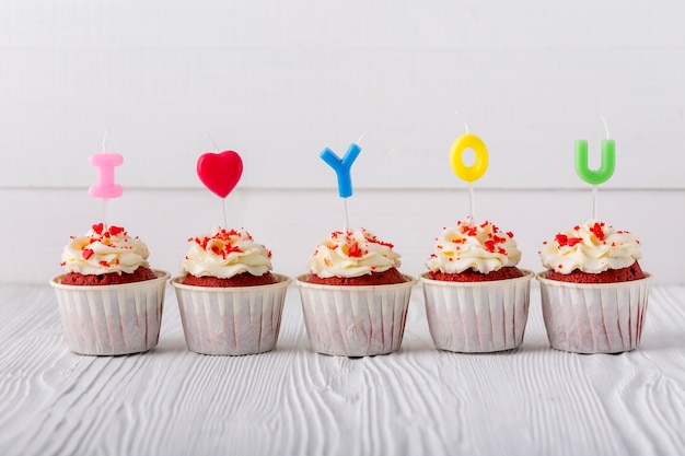 Front view of cupcakes with candles