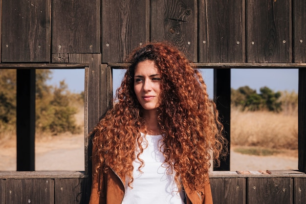 Front view curly redhead woman