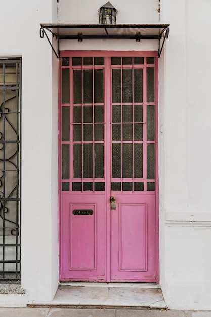 Front view of cute building door in the city