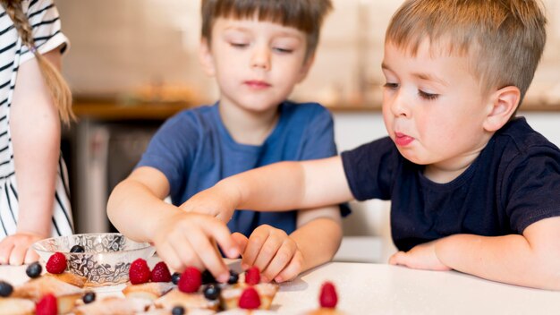 Front view of cute family cooking at home