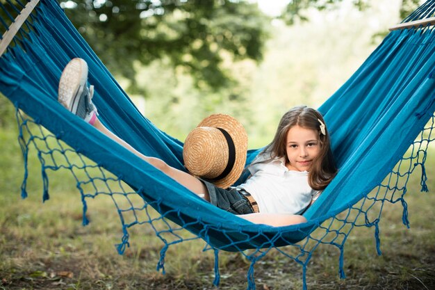 Front view of cute girl in hammock