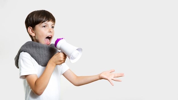 Free photo front view cute kid with microphone