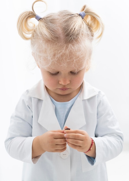 Front view of cute toddler with lab coat