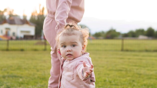 Front view cute youngster in pink clothes