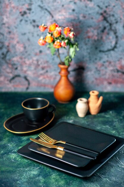 front view dark square plates with golden fork and knife on dark desk cutlery restaurant lunch color plate tea drink