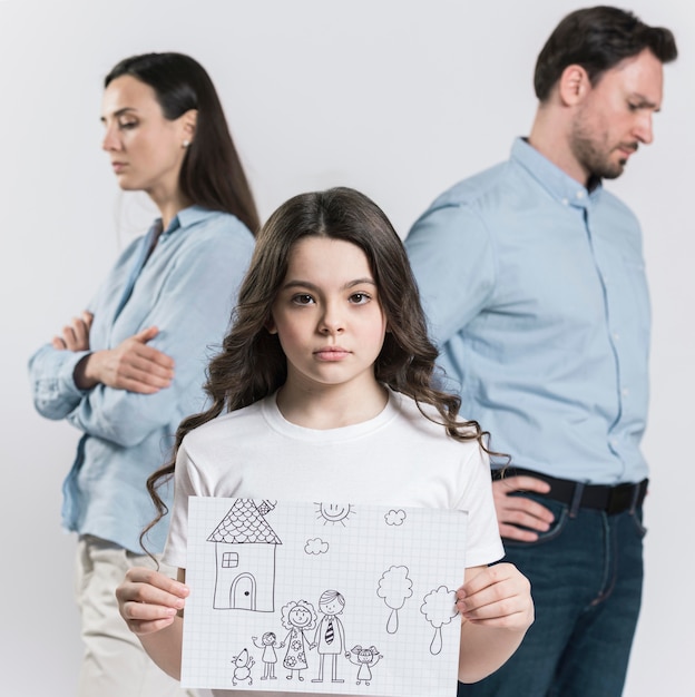 Front view daughter holding family drawing