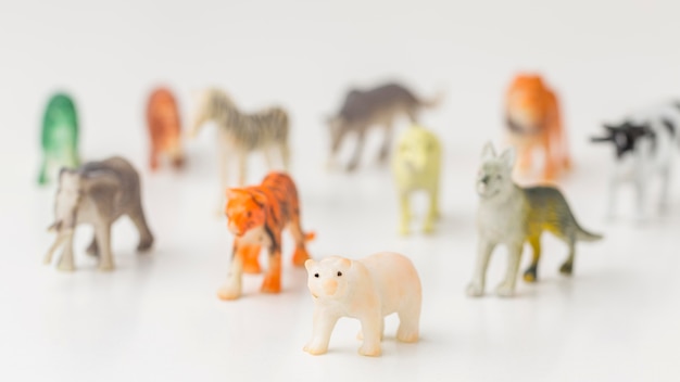 Front view of defocused animal figurines for animal day