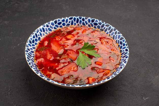 Front view delicious borsch ukranian beet soup on dark space