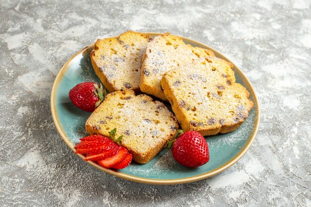 Front view delicious cake slices with fruits on light surface pie fruit cake sweet